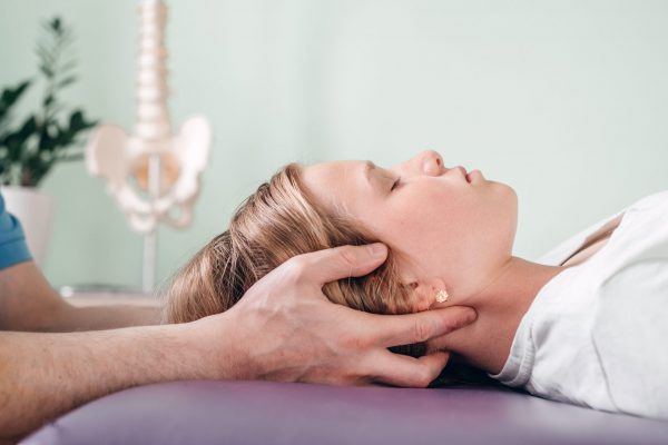 A girl receiving CST treatment, Osteopathic Manipulation and CranioSacral Therapy for children